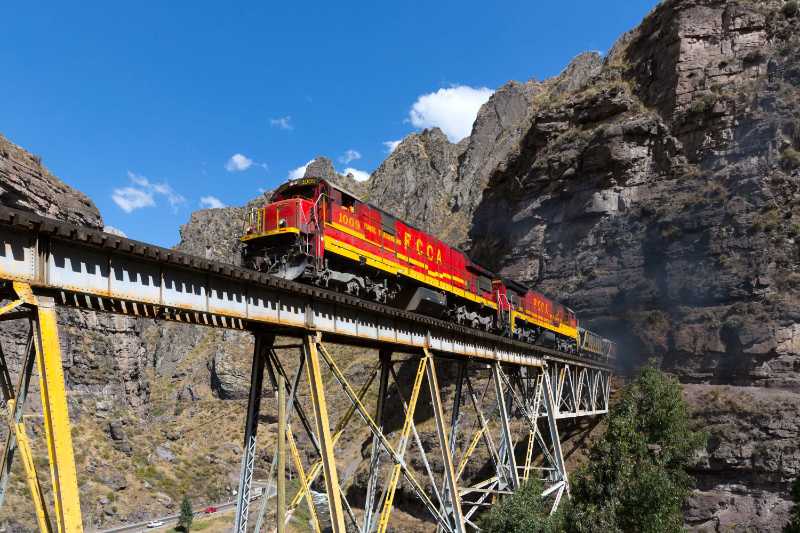 a train crossing a steel bridge - jigsaw puzzle