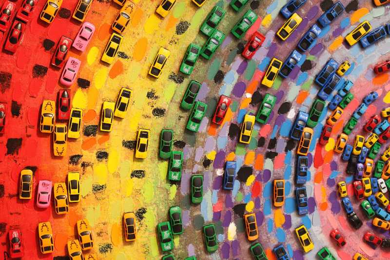 Toy cars on colored canvas - jigsaw puzzle