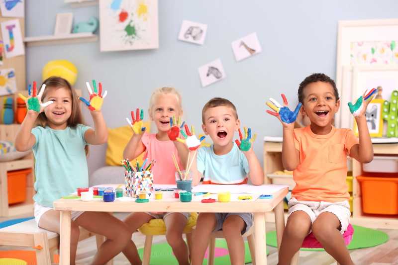 A Group of Children with Hand Paints