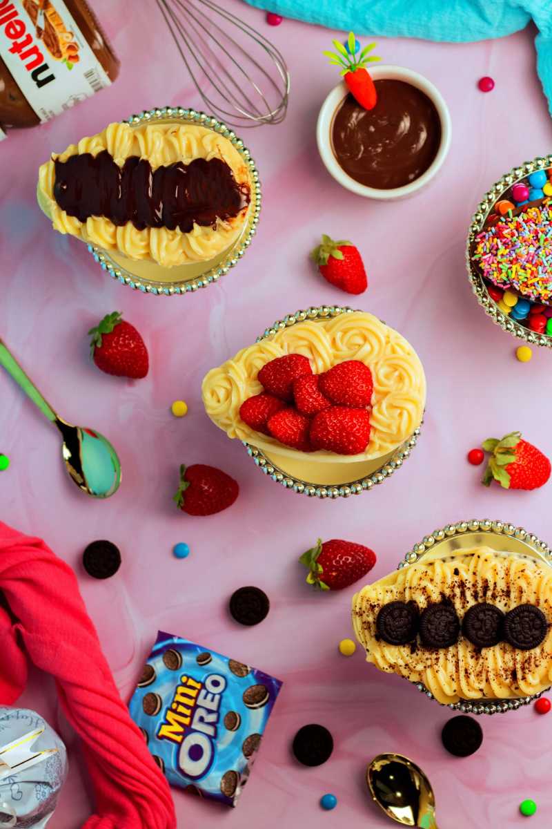 a pink table topped with desserts and candy - jigsaw puzzle