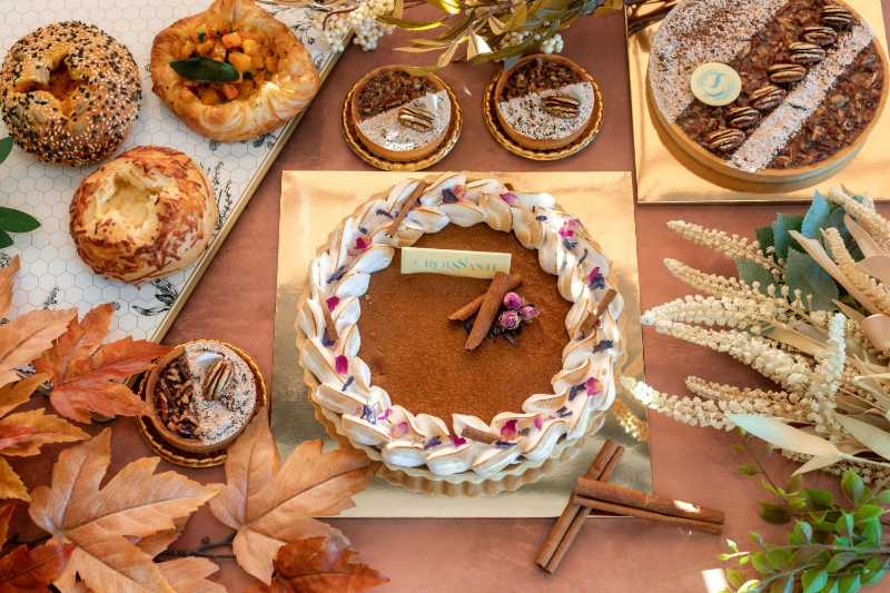 a table topped with a cake covered in frosting - jigsaw puzzle