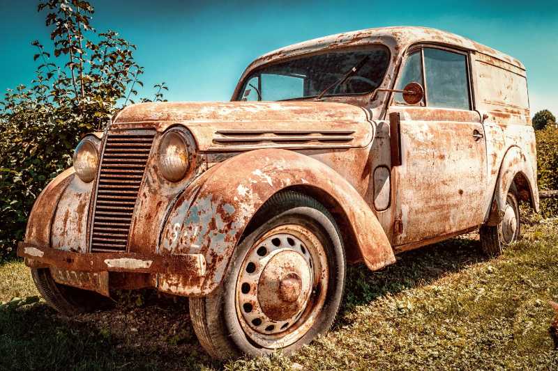 Abandoned Vintage Panel Van with Heavy Rust Patina