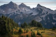 a scenic view of a mountain range with trees in the foreground  - jigsaw puzzle