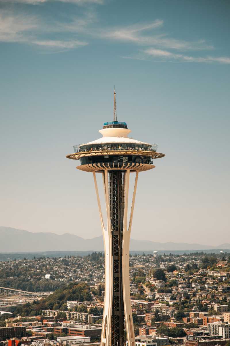 a tall tower with a sky scraper on top of it - jigsaw puzzle