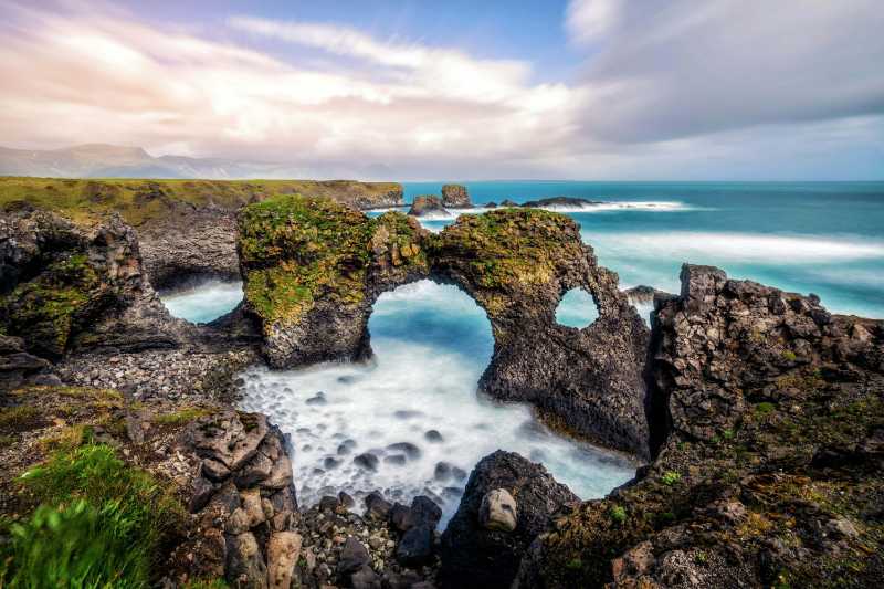 amazing stone arch gatklettur basalt rock on atlantic coast of arnarstapi in iceland