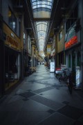 a narrow city street with a skylight above it - jigsaw puzzle