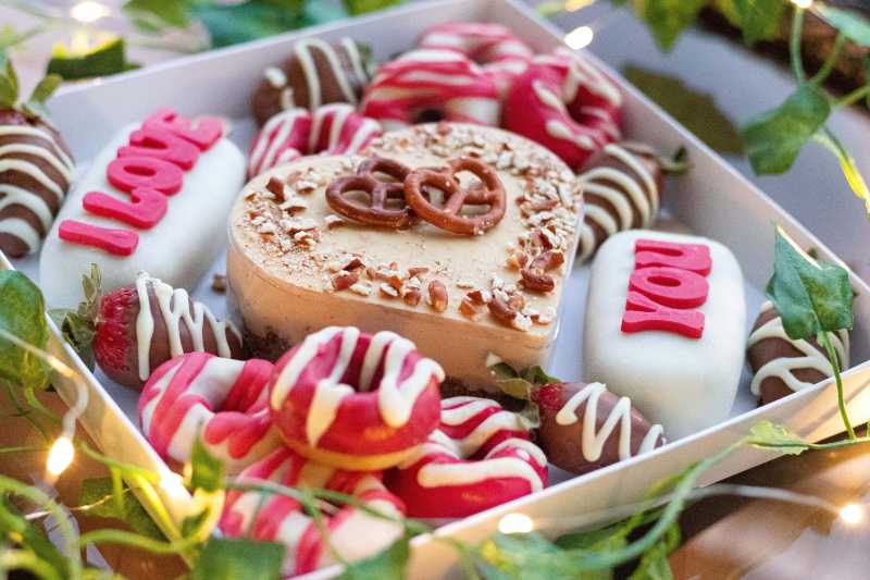 assorted desserts in a white box
