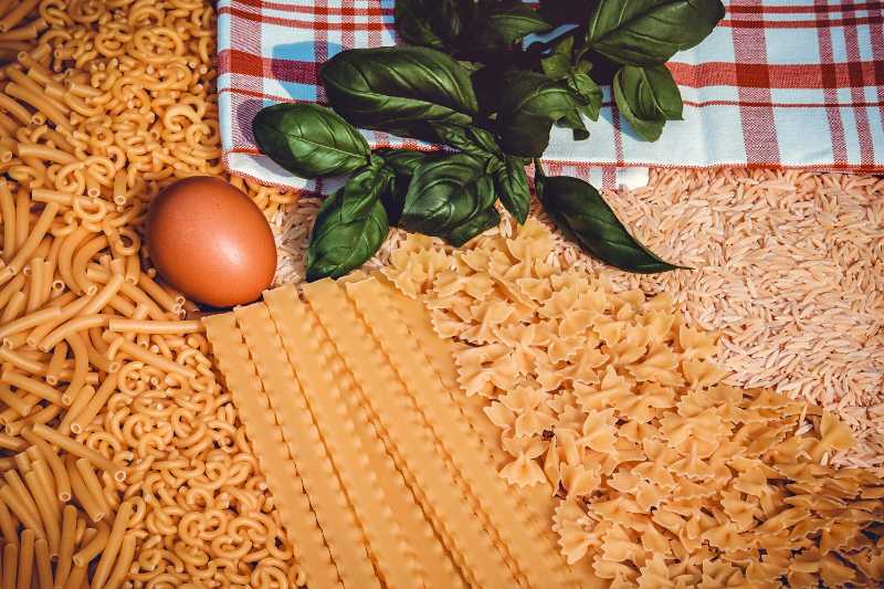 Assortment of Dry Italian Pasta Fresh Basil and Egg