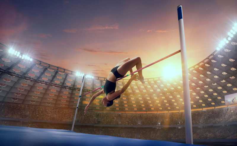 athlete woman doing a high jump on sport championship - jigsaw puzzle