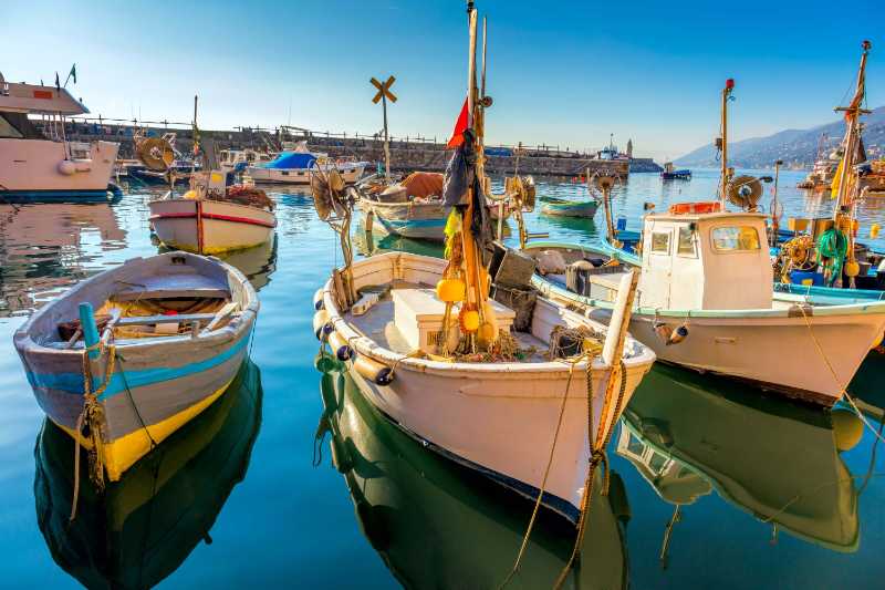 Beautiful old mediterranean town marina harbor with fish boats camogli italy