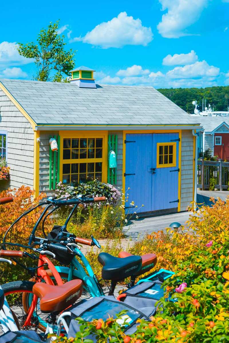 bicycles parked near blue and gray house during daytime - jigsaw puzzle