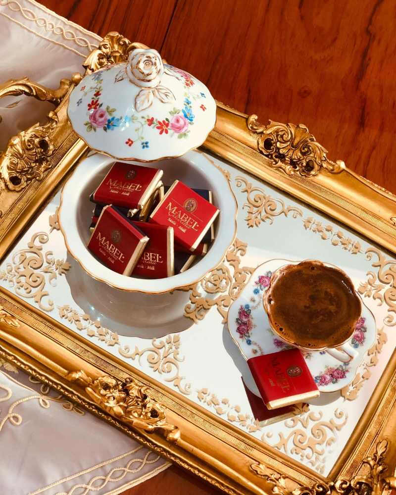 Bowl of Sweets and a Porcelain Cup of Coffee on a Tray