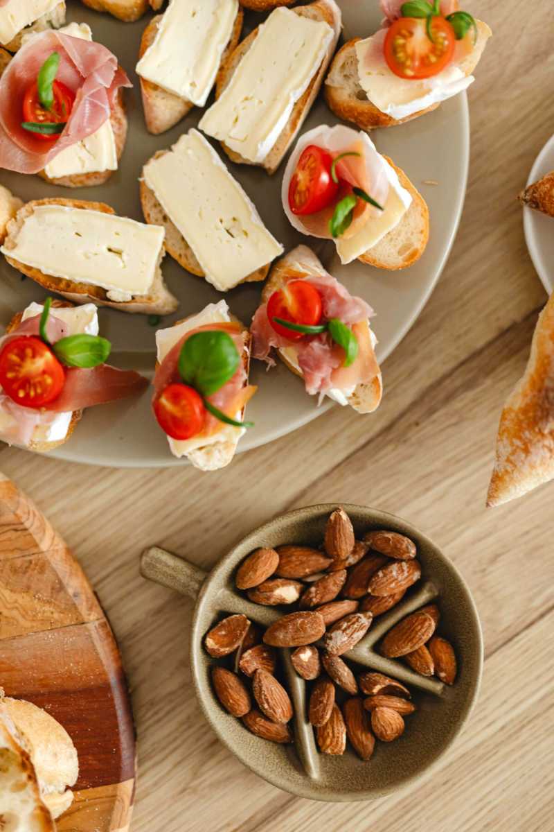Bread with Cheese and Vegetables on the Wooden Surface