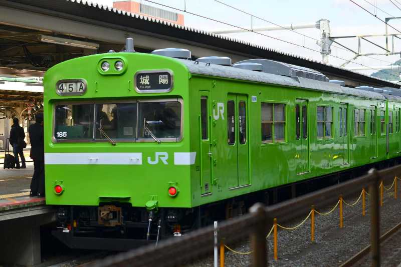 bright green train at kyoto station platform