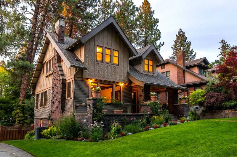 Brown Concrete House Near Green Grass Field