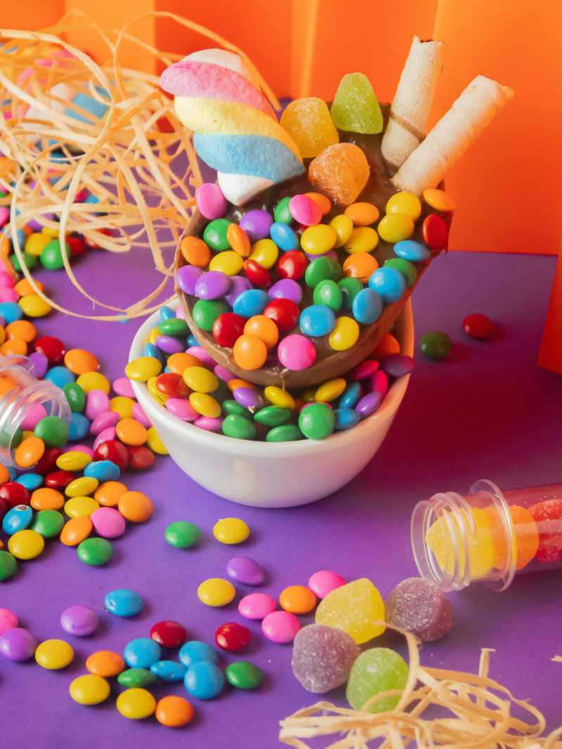 Candies and Dragettes on a Purple Background