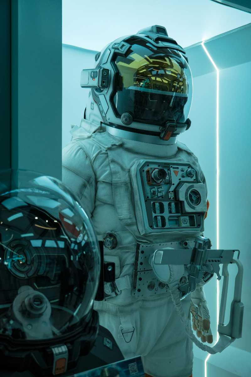 a man in a space suit standing next to a mirror - jigsaw puzzle