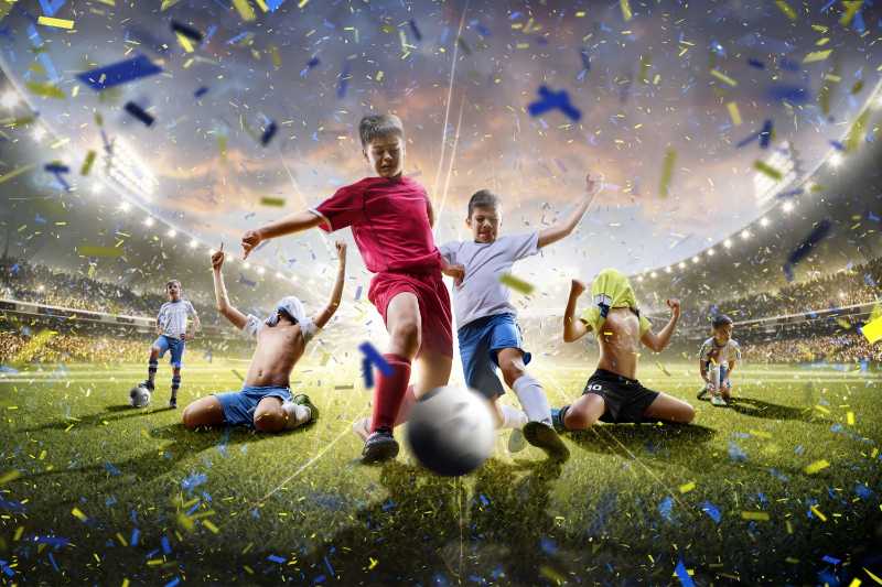 Children soccer players playing on stadium