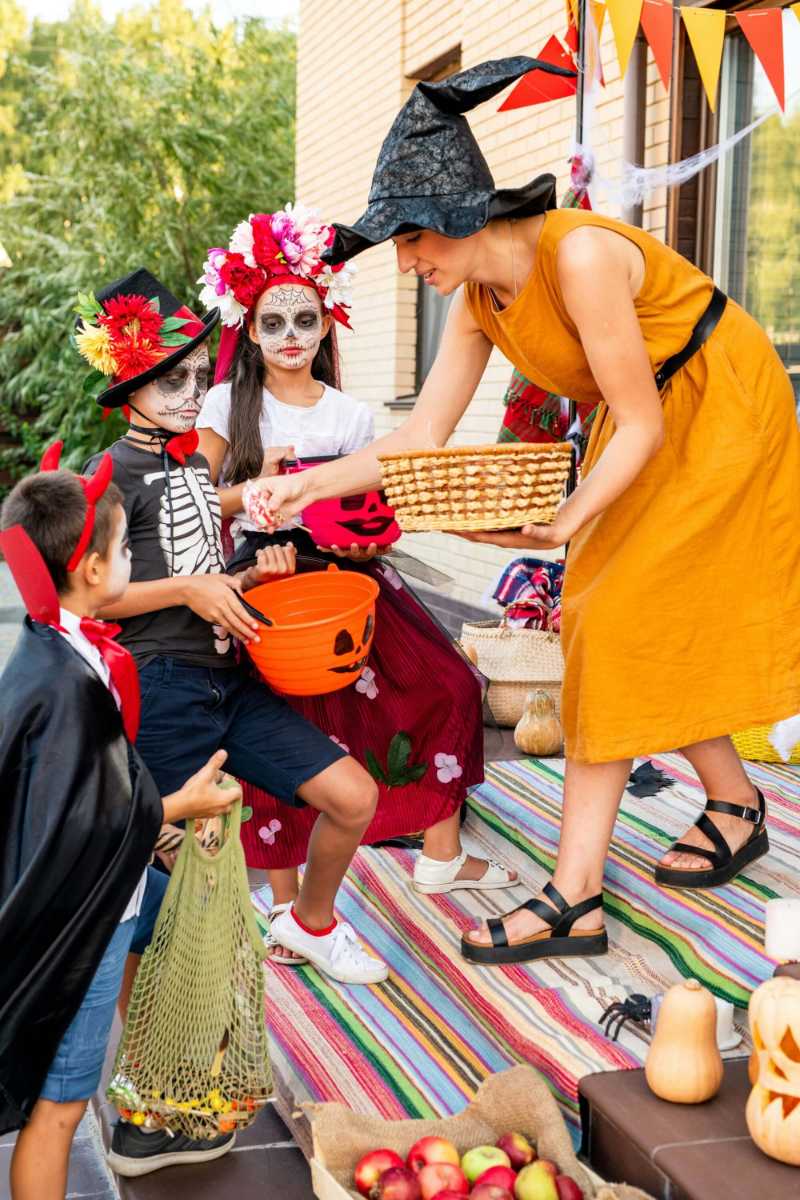 Children Trick-or-Treating with Sugar Skull Costumes