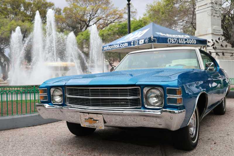 Classic Chevrolet Car Parked by Fountain in City Park