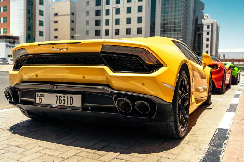 close up photo of yellow lamborghini Parked in Dubai City