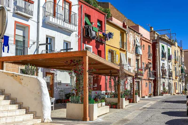 colorful facades of houses in alicante spain