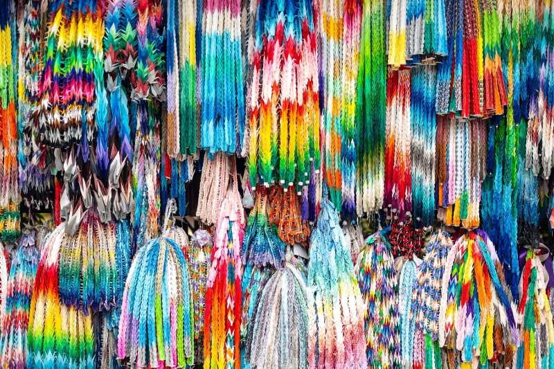 Colorful handmade paper cranes at the market