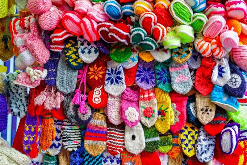 Colorful handmade socks and mittens for Christmas