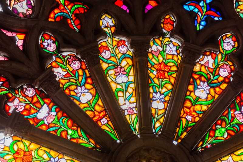 Colorful stained glass window with floral patterns