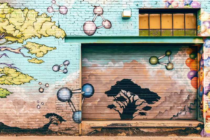 Colorful Street Art Mural with Trees and Molecules