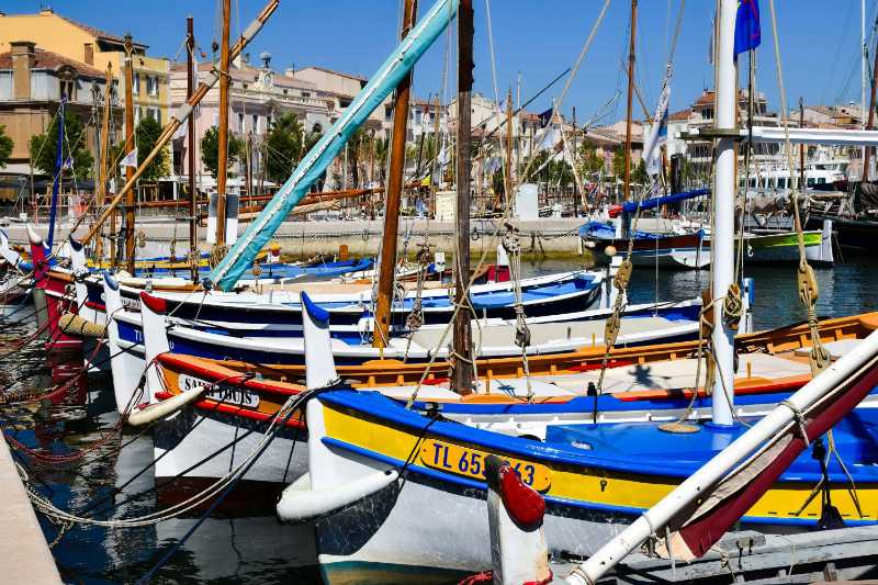 Colorful wooden sailboats in Provence harbor