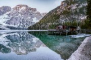 brown lakeside cottage beside rocky mountain - jigsaw puzzle