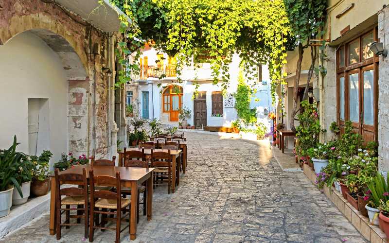 Empty small taverna in village panormos at crete island greece
