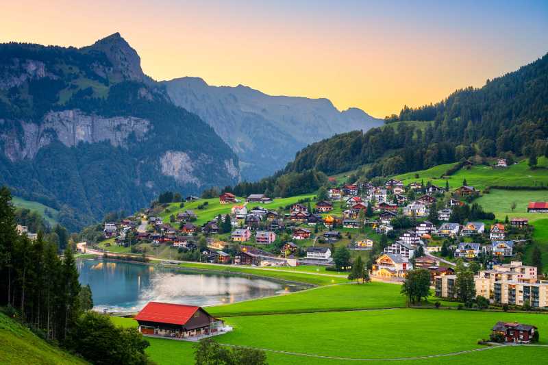 Alpine Village on Lake Shore at Sunset Switzerland