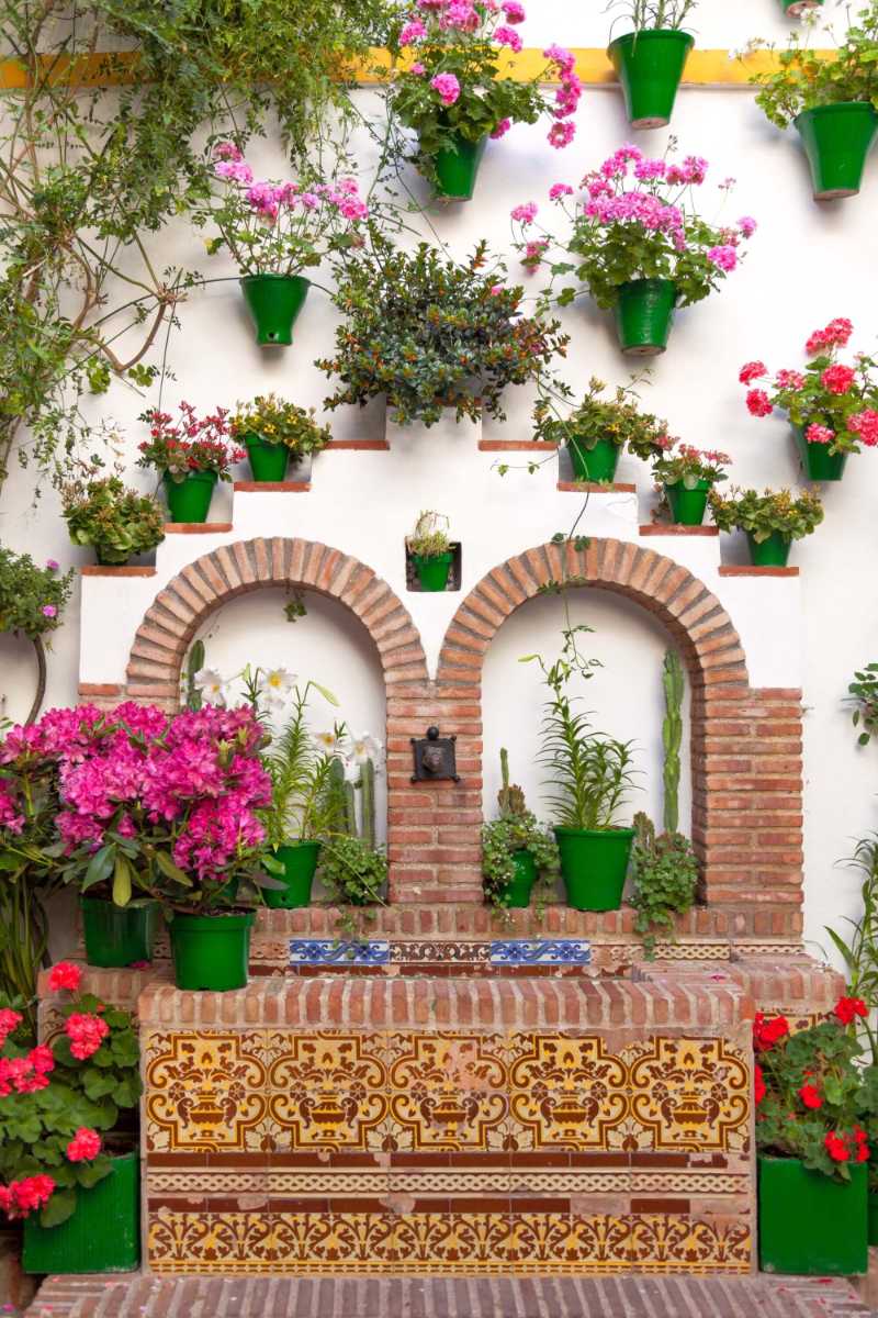 Flowers decoration on the wall of the ancient town of Cordoba