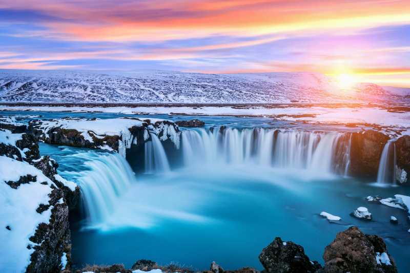 godafoss waterfall at sunset in winter iceland