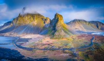 an aerial view of a mountain range with a river running through it - jigsaw puzzle