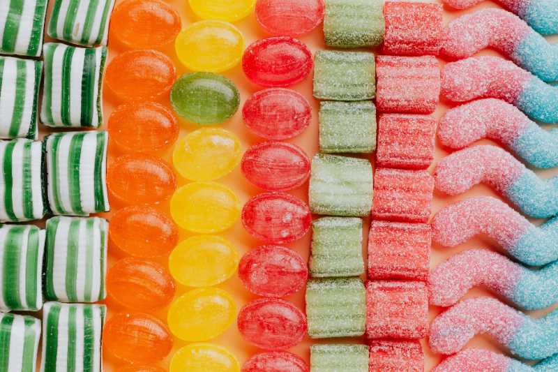 set of delicious jelly and caramel sweets arranged in lines by type - jigsaw puzzle