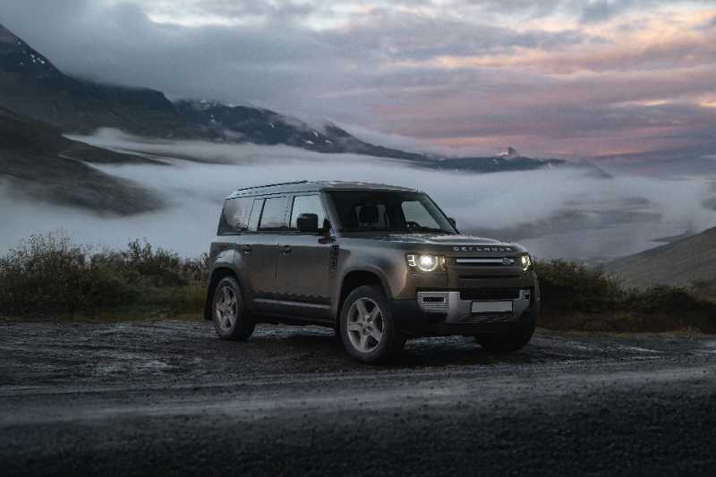 a land rover is parked on the side of the road - jigsaw puzzle