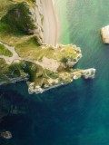 an aerial view of a beach and cliffs - jigsaw puzzle