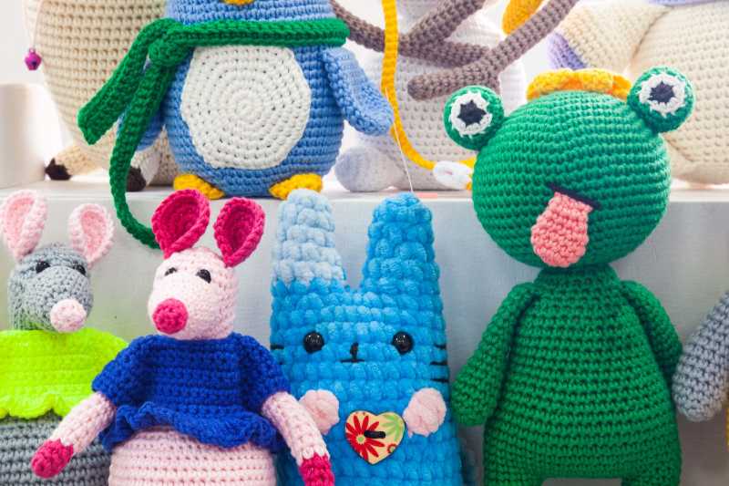 knitted multicolored toys form various animals