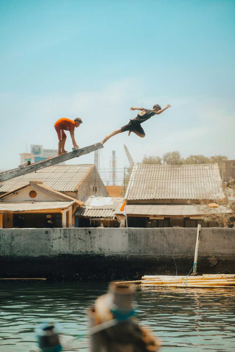 a couple of people that are jumping in the air - jigsaw puzzle