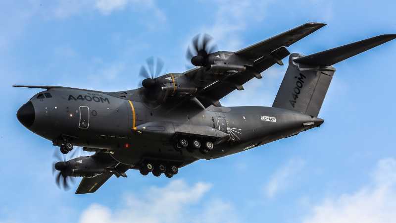 Modern Military Airlifter Airbus A400M Powering Through Clouds