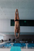 a person doing a handstand on a mat in a gym - jigsaw puzzle