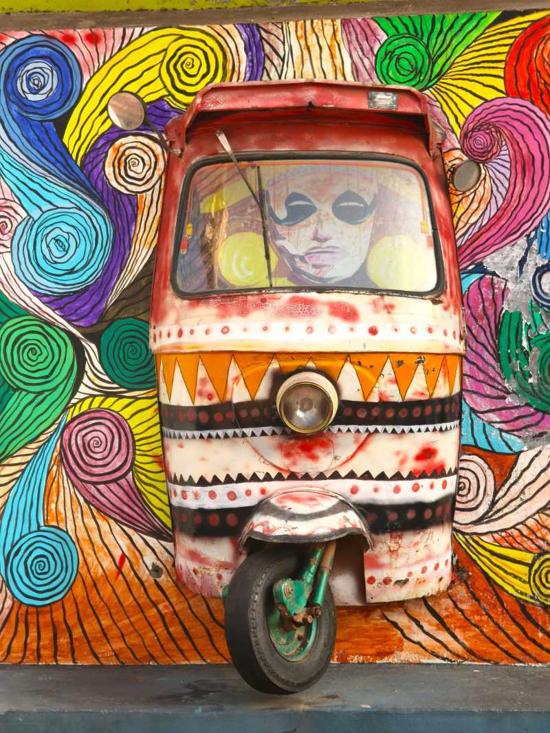 colorful artistic rickshaw on vibrant mural wall - jigsaw puzzle