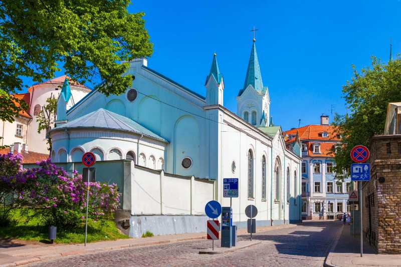 Our lady of sorrow catholic church and medieval street in old riga city latvia