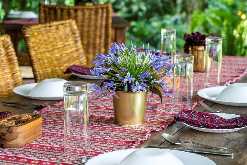 Outdoor Dining Table Setting with Blue Agapanthus Centerpiece