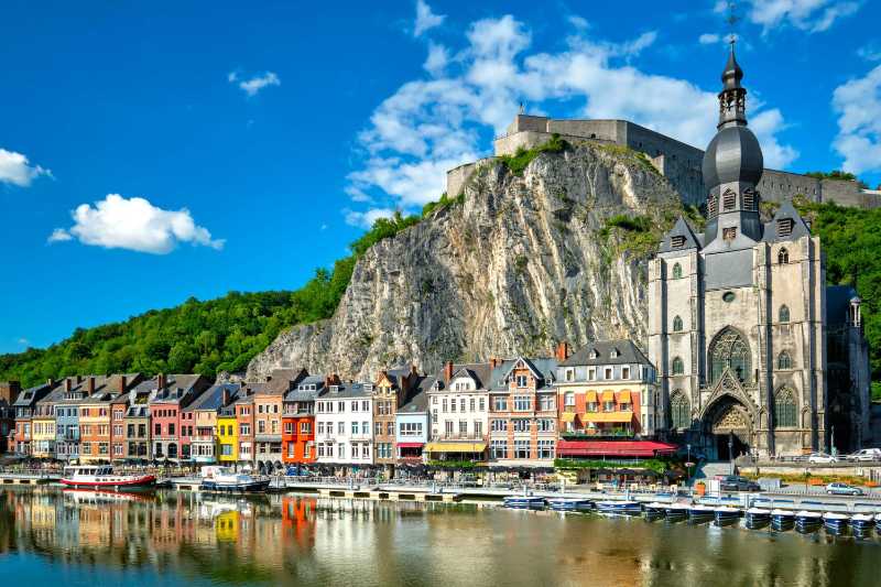 Picturesque town of Dinant Citadel of Dinant and Notre-Dame de Dinant church on the Meuse River Namur province Belgium