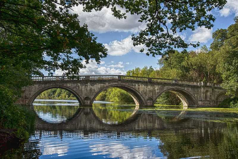 bridge over a lake during day time - jigsaw puzzle