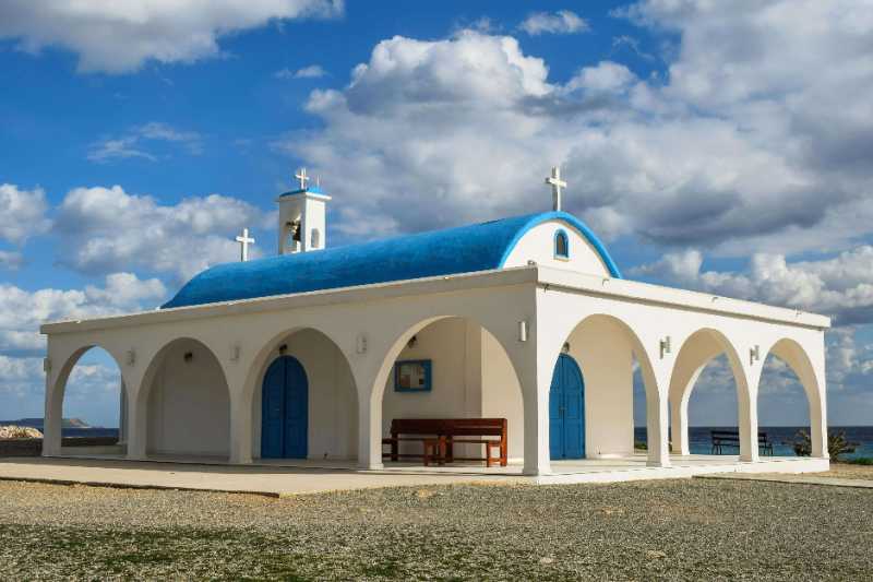 white and blue painted church under blue sky - jigsaw puzzle